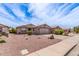 Street view of the single Gathering homes with desert landscaping and concrete driveways at 1395 E Runaway Bay Dr, Chandler, AZ 85249