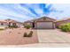 Single Gathering home with a desert landscape, wide driveway, and neutral paint scheme at 1395 E Runaway Bay Dr, Chandler, AZ 85249