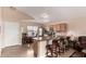 Well-lit eat-in kitchen area with stainless steel appliances, and a breakfast bar featuring wood chairs at 1395 E Runaway Bay Dr, Chandler, AZ 85249