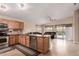 Open concept kitchen with granite countertops, stainless steel appliances, and a cozy breakfast bar at 1395 E Runaway Bay Dr, Chandler, AZ 85249