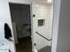 Bathroom showcasing a modern glass-enclosed shower with sleek black and white tiling at 1449 E Highland Ave # 25, Phoenix, AZ 85014