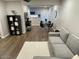 Open-concept living room featuring hardwood floors and a round dining table near the kitchen at 1449 E Highland Ave # 25, Phoenix, AZ 85014