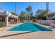 Inviting community pool with lounge chairs and shaded seating area, perfect for relaxation at 1449 E Highland Ave # 25, Phoenix, AZ 85014