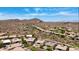 Expansive aerial perspective revealing luxury homes nestled within a picturesque community at 14523 E Charter Oak Dr, Scottsdale, AZ 85259