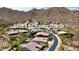 Overhead view featuring a neighborhood with swimming pools and manicured landscaping at 14523 E Charter Oak Dr, Scottsdale, AZ 85259