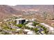Expansive aerial view of a desert community nestled amidst stunning mountain scenery and lush greenery at 14523 E Charter Oak Dr, Scottsdale, AZ 85259