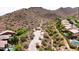 Scenic aerial view of homes near hiking trails set against a backdrop of desert mountains at 14523 E Charter Oak Dr, Scottsdale, AZ 85259