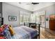 Bedroom with a view of the patio featuring large windows and wood-look floors at 14523 E Charter Oak Dr, Scottsdale, AZ 85259