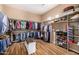 Spacious walk-in closet with built-in shelving and hanging rods for ample storage at 14523 E Charter Oak Dr, Scottsdale, AZ 85259