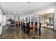 Open-concept dining area features slate floors, a wood table, and seamless access to the kitchen at 14523 E Charter Oak Dr, Scottsdale, AZ 85259