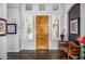 Bright foyer with a wooden door, large windows, and elegant decor, setting a welcoming tone for the rest of the home at 14523 E Charter Oak Dr, Scottsdale, AZ 85259