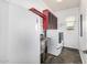 Well-organized laundry room including a stainless steel utility sink and modern appliances at 14523 E Charter Oak Dr, Scottsdale, AZ 85259