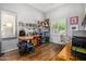 Bright home office with desk, natural light and wood floors at 14523 E Charter Oak Dr, Scottsdale, AZ 85259