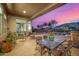 Outdoor patio featuring a variety of seating options, desert landscaping and pool at 14523 E Charter Oak Dr, Scottsdale, AZ 85259