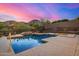Inviting pool featuring a unique tiered design and stone accents, perfect for relaxation and entertainment at 14523 E Charter Oak Dr, Scottsdale, AZ 85259