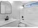 Modern bathroom featuring stylish fixtures, a sleek vanity, and a shower-tub combination with glass enclosure at 1563 S Longspur Ln, Gilbert, AZ 85296