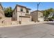 Charming two-story home with a two-car garage and desert landscaping at 1563 S Longspur Ln, Gilbert, AZ 85296