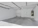 Spacious garage with concrete floors, utility connections, and modern lighting at 1563 S Longspur Ln, Gilbert, AZ 85296
