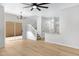 Open concept living area with stairs, vinyl floors and modern chandelier at 1563 S Longspur Ln, Gilbert, AZ 85296