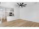 Spacious living room with natural light and wood-look floors open to a gorgeous, updated kitchen at 1563 S Longspur Ln, Gilbert, AZ 85296