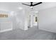 Upstairs loft area with carpet floors and natural lighting at 1563 S Longspur Ln, Gilbert, AZ 85296