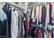 This closet has built-in shelving and plenty of hanging storage for clothing at 15743 N 165Th Ln, Surprise, AZ 85388