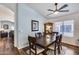Inviting dining room featuring a wooden table set, decorative hutch, and plush rug at 15743 N 165Th Ln, Surprise, AZ 85388
