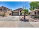 Charming single-story home featuring a well-maintained yard, desert landscaping and an attached two-car garage at 15743 N 165Th Ln, Surprise, AZ 85388