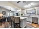 Open-concept kitchen with an island, pendant lighting, stainless appliances, and seating at 15743 N 165Th Ln, Surprise, AZ 85388