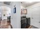 Convenient laundry room with modern washer and dryer set near kitchen at 15743 N 165Th Ln, Surprise, AZ 85388