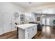 Stylish kitchen island with a view to the living area and backyard access at 15743 N 165Th Ln, Surprise, AZ 85388