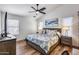 Comfortable bedroom featuring a ceiling fan, large bed, and ample natural light at 15743 N 165Th Ln, Surprise, AZ 85388