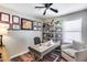 This office has luxury vinyl plank flooring, a ceiling fan, and built-in shelving at 15743 N 165Th Ln, Surprise, AZ 85388