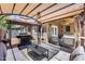 Inviting covered patio with comfortable seating and outdoor kitchen area, perfect for entertaining guests at 15743 N 165Th Ln, Surprise, AZ 85388