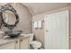 Stylish bathroom features vessel sink, granite vanity top, modern fixtures, and a decorative mirror at 16017 S 12Th Pl, Phoenix, AZ 85048