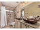 Bathroom featuring dual vessel sinks, updated finishes, and glass shower at 16017 S 12Th Pl, Phoenix, AZ 85048
