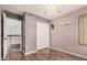 Neutral bedroom with a window, closet, and wood floors at 16017 S 12Th Pl, Phoenix, AZ 85048