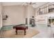 Spacious game room boasting a billiard table, high ceilings, and a view of the second floor at 16017 S 12Th Pl, Phoenix, AZ 85048