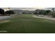 Expansive golf course view with lush green grass and desert landscaping, set against a backdrop of scenic mountains at 16017 S 12Th Pl, Phoenix, AZ 85048