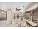 Bright eat-in kitchen features white cabinets, stainless appliances, and an island with bar seating and granite countertops at 16017 S 12Th Pl, Phoenix, AZ 85048