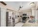 Well-lit kitchen offers stainless steel appliances, granite countertops, stylish fixtures, and tile flooring at 16017 S 12Th Pl, Phoenix, AZ 85048