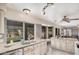 Open kitchen with granite counters, stainless appliances and lots of windows offering natural light and backyard views at 16017 S 12Th Pl, Phoenix, AZ 85048