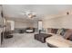 Comfortable living room featuring tile floors, a ceiling fan, and a cozy seating arrangement at 16017 S 12Th Pl, Phoenix, AZ 85048
