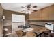 Home office space with lots of storage and a large wood desk at 16017 S 12Th Pl, Phoenix, AZ 85048