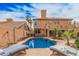 Inviting pool with comfortable lounge chairs, lush greenery, and a well-maintained backyard at 16017 S 12Th Pl, Phoenix, AZ 85048