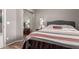 Comfortable bedroom with large mirror sliding doors and a red and white bedspread at 16626 E Westby Dr # 108, Fountain Hills, AZ 85268