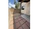 Enclosed patio with brick ground cover and dirt area with cinder block perimeter wall at 170 E Guadalupe Rd # 173, Gilbert, AZ 85234