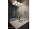 Bathroom featuring a modern vanity and a well lit mirror at 170 E Guadalupe Rd # 173, Gilbert, AZ 85234
