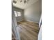 An empty bedroom with vinyl floors and a window with natural light at 170 E Guadalupe Rd # 173, Gilbert, AZ 85234