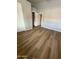 Bedroom features wood-look flooring, closet and entry door, and neutral paint at 170 E Guadalupe Rd # 173, Gilbert, AZ 85234
